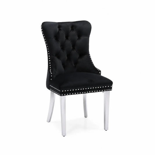 Silla de terciopelo negro con patas metálicas